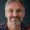 close up portrait of a happy senior man isolated 2025 08 27 20 34 16 utc